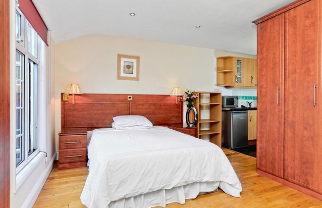 Baker Street Suites - Photo 37