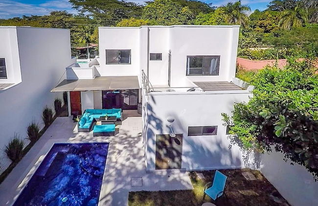 Ultramodern Townhome with an Inviting Coastal Design and Lush Outdoor Oasis with a Private Pool - Photo 35