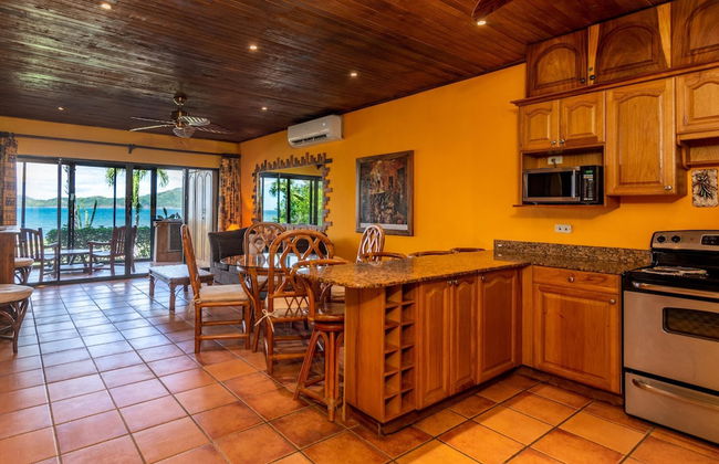 Beachfront Condo with Warm, Rustic Interiors & Direct Access to Playa Flamingo - Photo 9