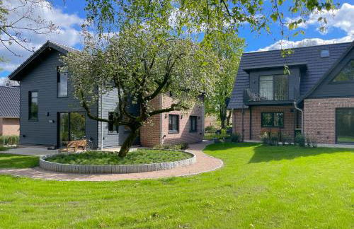 Traumhafte Ferienwohnung am Park, großer Balkon, voll ausgestattete Küche, Schreibtisch, WiFi, Smart TV, Carport, Wallbox, Fahrräder - Foto 57