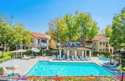 Poolside 2BR Condo with Balcony & Workspace - Photo 2