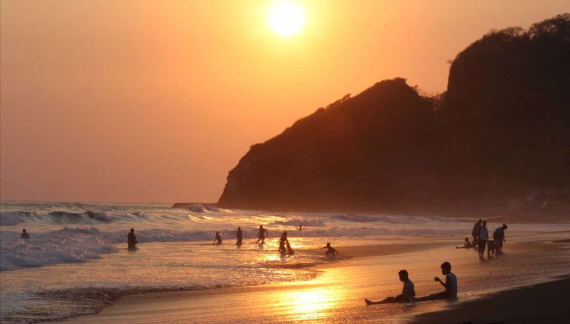 See the sunset at the beach