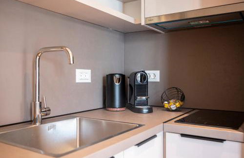 Unicos City Suites - Photo 18