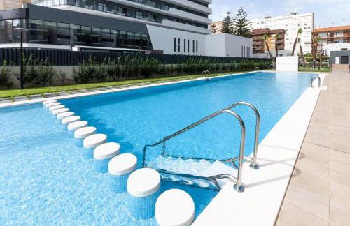 Apartamento nuevo junto al mar con plaza de garaje!! Perfecto para familias - Photo 12