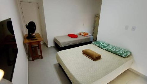 Suíte privativa aconchego a alguns passos da praia - Foto 3