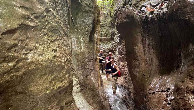 3 or 4-day Orangutan Watching in Gunung Leuser - Photo 5, Trekking through a canyon in the park
