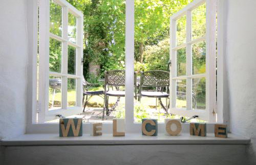 Putsborough Manor 3 Self Catering Cottages with Beach a short walk, dog friendly all year, On site Tennis, Play Area, Paddock, Spa baths, BBQ, Private Gardens, Superfast WIFI - Photo 9