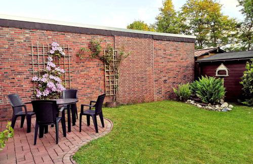 Haus Meereswind Esens, Wintergarten mit Kamin - Foto 16