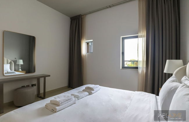 WelHome - Prime 1BR Apartment at Oia Residence - Photo 6