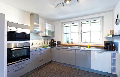 Exklusives Penthouse mit Dachterrasse, hochwertig ausgestatteter Küche mit Dampfgarer, inklusive 2 Stellplätze und Fahrradgarage - Foto 14