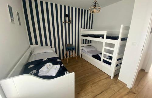 SOLEK, Apartamenty hotelowe i pokoje gościnne ze śniadaniem, przyjazne zwierzętom, wyjątkowe, z widokiem na Jezioro Jamno i w bardzo bliskiej odległości od morza - Foto 52