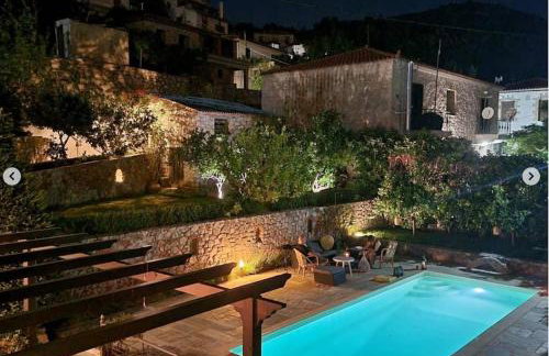 Stone house 1883 Kymi with pool - Photo 2