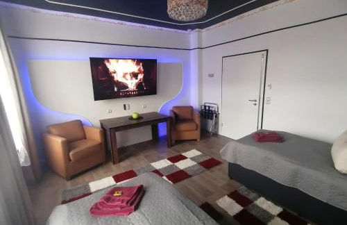 Best-Preis -Gold Suite- mit Netflix, Self-Check-In, eBike Ladestation, Fahrradraum, WLAN, Netflix und Massagesessel - direkt am Elberadweg im Herzen von Wittenberge - Foto 1