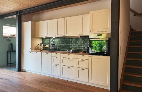 Amber Ferienhain - Ferienhaus 'Magnolie' mit verwunschenem Garten & privater Sauna - Foto 8