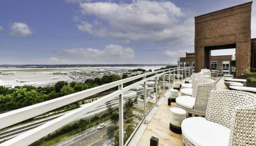 Comfy 2BR Oasis with Scenic Rooftop & Gym - Photo 2