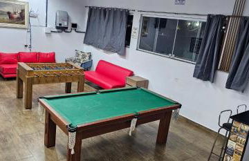 Belíssima Casa a Beira Mar com Piscina Aquecida Cobrado a Parte, 5 Quartos com Ar Condicionado, Amplo Salão de Jogos com Mesas de Bilhar e Pebolim, Amplo Espaço Externo com Churrasqueira em Deck Gourmet Coberto frente a Piscina,Tudo isso á Beira Mar - Photo 14