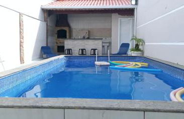 "Lindíssima Casa Pé na Areia com Opção da Piscina Aquecida Cobrado a Parte, Sala de Jantar, 3 Amplos Quartos, Sendo1Suíte, Amplo Espaço de Lazer com Área Gourmet em Deck Coberto com Churrasqueira e Mesa de Bilhar Frente a Piscina, Super Pertinho da Praia" - Photo 6