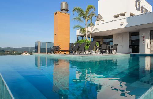 Ap completo a 900m da Vila Germânica com Piscina, Academia, Wi-Fi, Ar, Garagem e Tv no quarto - Foto 1