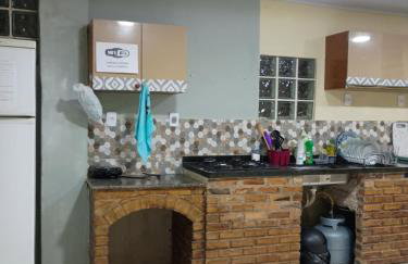 Casa quatro com cozinha americana e quintal compartilhado - Foto 12