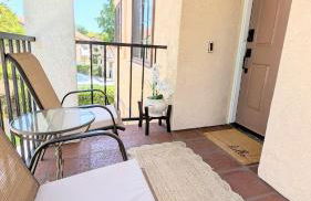 Poolside 2BR Condo with Balcony & Workspace - Photo 6