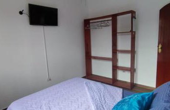 Casa Rosa de Peruíbe - Casa de Temporada 3 dormitórios, 10 hóspedes, piscina, wi-fi, netflix, 800 metros da praia - Photo 31