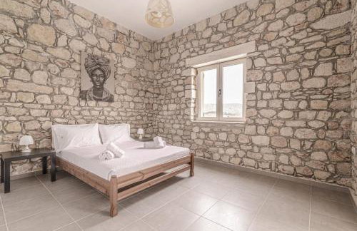 Elysian Stone Villa with Pool & Mountain View - Photo 15