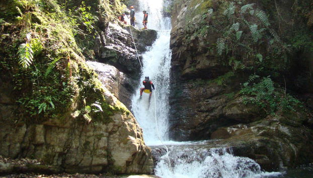 Abseiling down the waterfall
