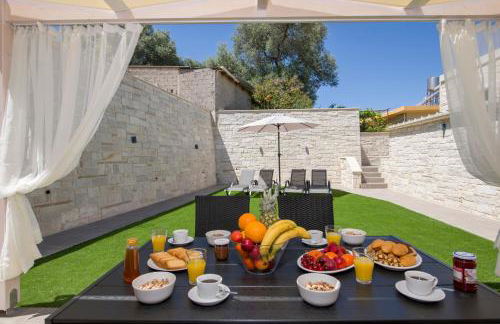 TWIN'S HOME LUXURY SUITES - Photo 28