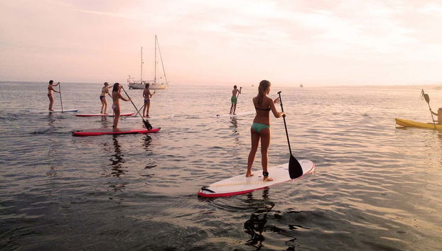 Paddling alongside a boat