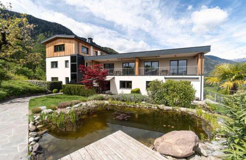 Felsenegg appartements - moderne Wohnungen im Luftkurort mit traumhaftem Garten Nähe Meran für Paare und Familien - Foto 1