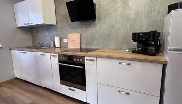 Gemütliches Appartement mit Terrasse und Gartenblick - Foto 5, stove, dishwasher, toaster