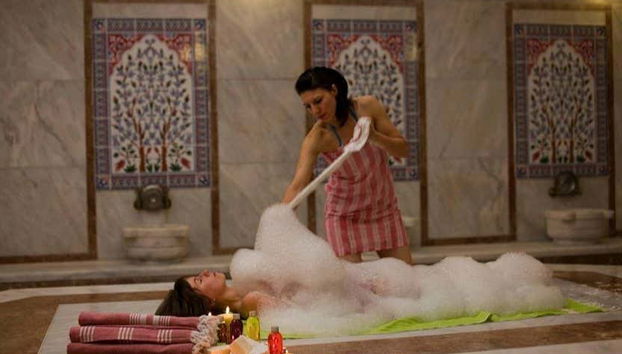 Enjoying the foam massage treatment