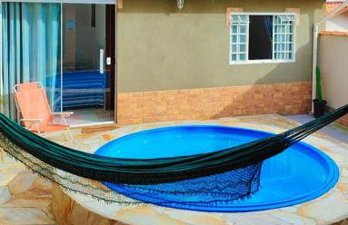 Casa Espaço Sara Piscina com total privacidade, área gourmet completa com churrasqueira fogão a lenha, a 5min do centro e do parque das águas - Foto 1