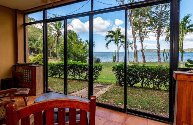 Beachfront Condo with Warm, Rustic Interiors & Direct Access to Playa Flamingo - Photo 1