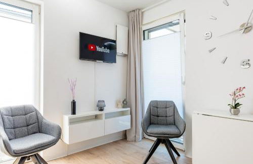 Modernes Apartment mit Terrasse & Garten, Parkplatz & 24h Self-Check-in - Foto 11