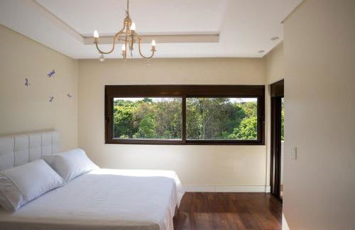 Refúgio de Luxo e Piscina à beira do Passaúna - Photo 30