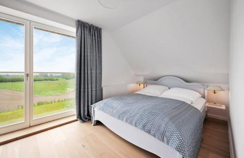 GUT KLETKAMP "Mühlenhof 5" - Ruhige Ferienwohnung mit 3 Schlafzimmern I Terrasse mit See- & Naturblick I Gemeinschaftsgarten I 15 Min zur Ostsee I Küche I Parkplatz I Waschmaschine I WLAN - Foto 7