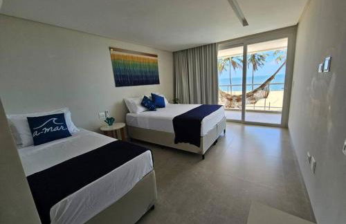 Piscina aquecida, 5 suítes e pé na areia com vista espetacular!! - Photo 4