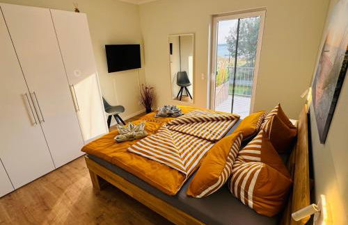 8 Personen Ferienhaus ,,Seegelblick" am Goitzschesee, erste Reihe am Strand mit Sauna, Whirlpool, Kamin, Wallbox & SUP - Foto 9