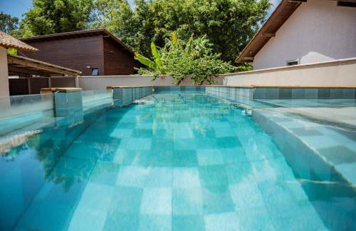 Casa Rústica com Piscina Privativa, Banheira de Hidromassagem, Ar-Condicionado, Pet friendly - Refúgio na Natureza a 5 Minutos do Centro de Imbituba, Perfeita para Famílias e Grupos - Photo 49