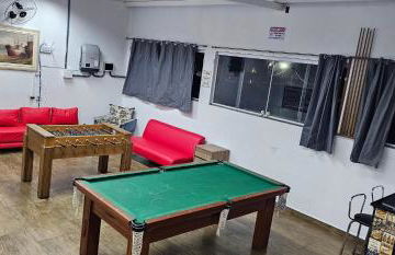 Belíssima Casa a Beira Mar com Piscina Aquecida Cobrado a Parte, 5 Quartos com Ar Condicionado, Amplo Salão de Jogos com Mesas de Bilhar e Pebolim, Amplo Espaço Externo com Churrasqueira em Deck Gourmet Coberto frente a Piscina,Tudo isso á Beira Mar - Photo 13