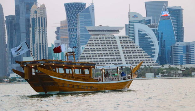 Admire a sunset in Doha from a traditional Arabic boat