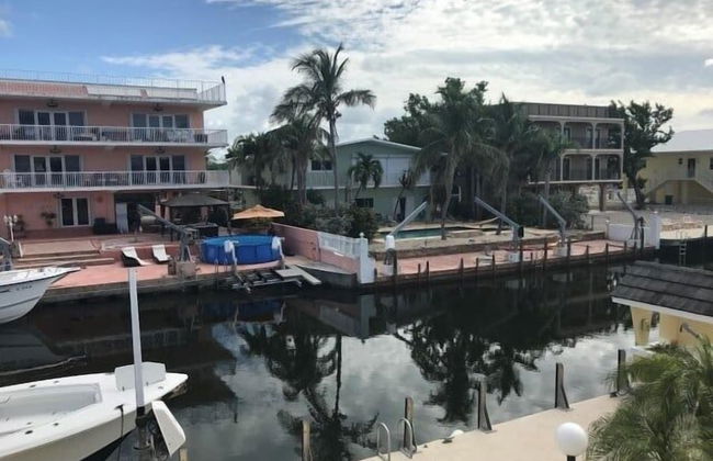 Beautiful Canal Front Home With Above Ground Pool, Dock And Fish Cleaning Station 4 Bedroom Home by RedAwning - Photo 1