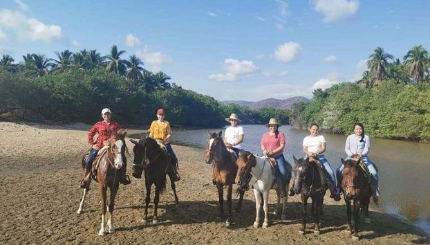 Taking a photo on Larga Beach
