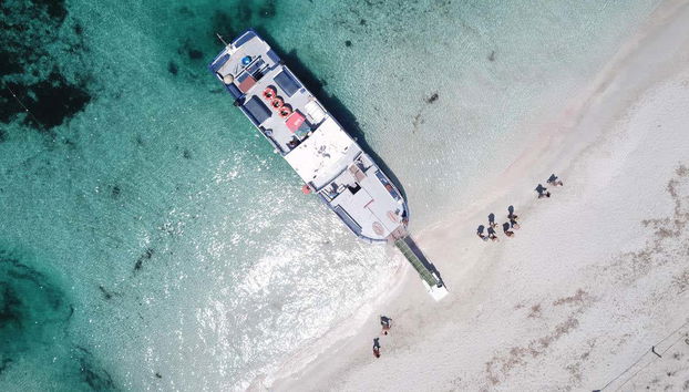 Getting off the boat at the beach