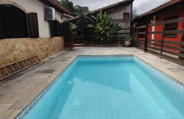 Ampla casa em condomínio a 300mt da praia - Foto 12