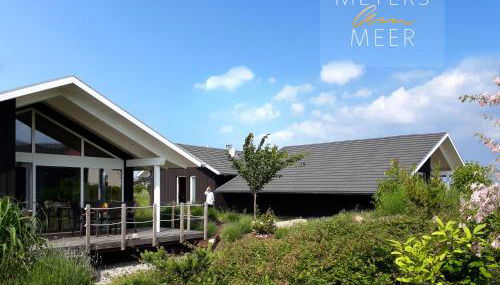 Schwarzes Holzferienhaus mit Sauna -- GARTENGLÜCK -- an der Ostsee, Zierow bei Wismar, Strand 500m, 2 Schlafzimmer - Photo 5, Garden, Garden view