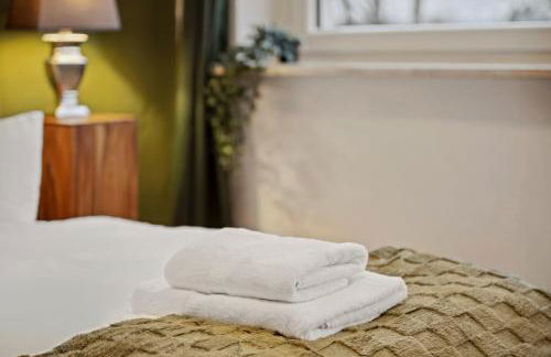 MAISUITES Sperling - Zentrale Ferienwohnung mit Boxspringbett, Kaffeevollautomat, WLAN & seitlichem Seeblick - Foto 22