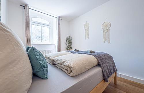 Gemütliche Ferienwohnung mit 2 Schlafzimmern, kostenfreiem Parkplatz, modernem Bad, Küche, Waschmaschine & Trockner - Foto 15