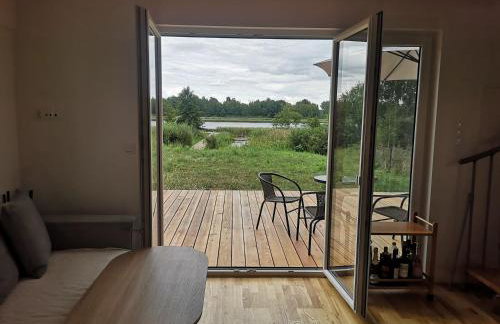 Dom nad jeziorem z prywatnym pomostem i linią brzegową - Foto 11